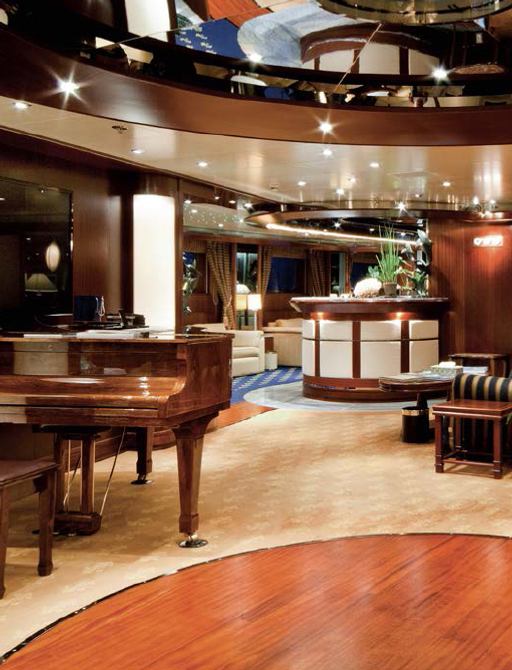 The salon and living room on board superyacht Lauren L with grand piano