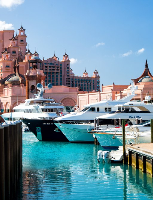 Overview of the Atlantis hotel in the Bahamas with charter yachts berthed in the marina