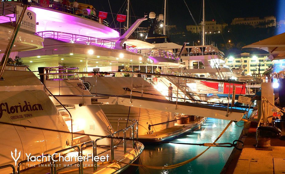 Luxury yachts at night in Monaco Harbour